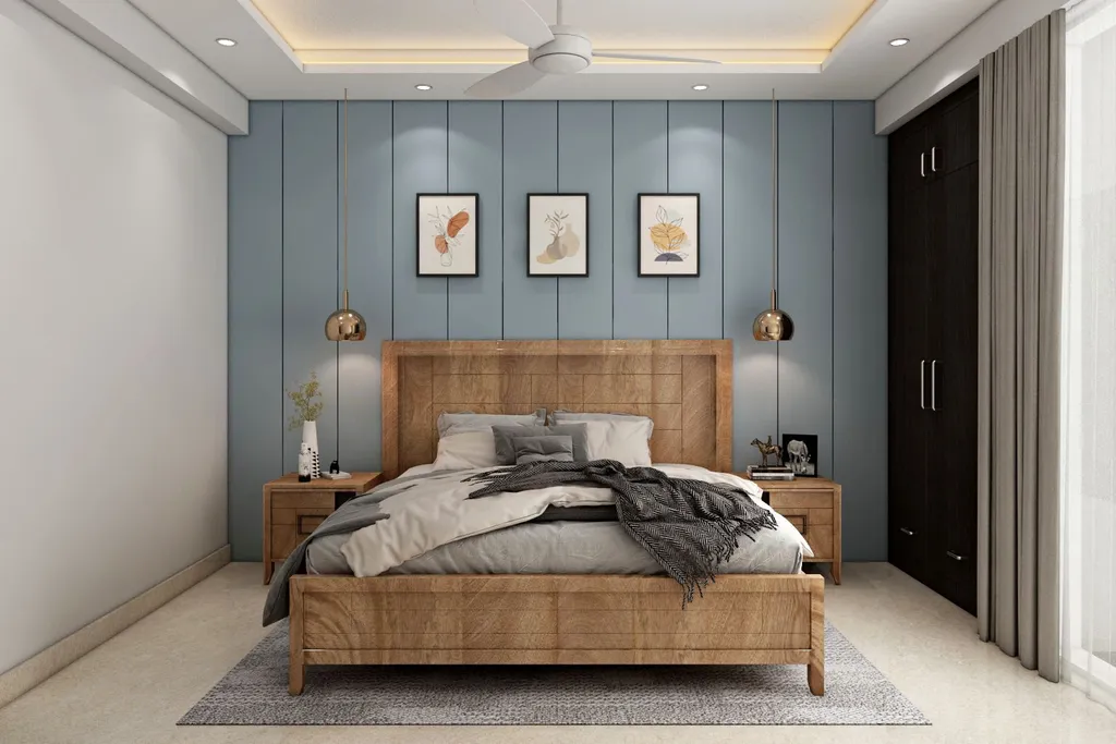 A bedroom with blue walls, a wooden bed, two nightstands, and framed pictures.